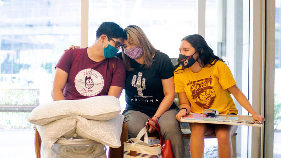 student in mask leaning 
